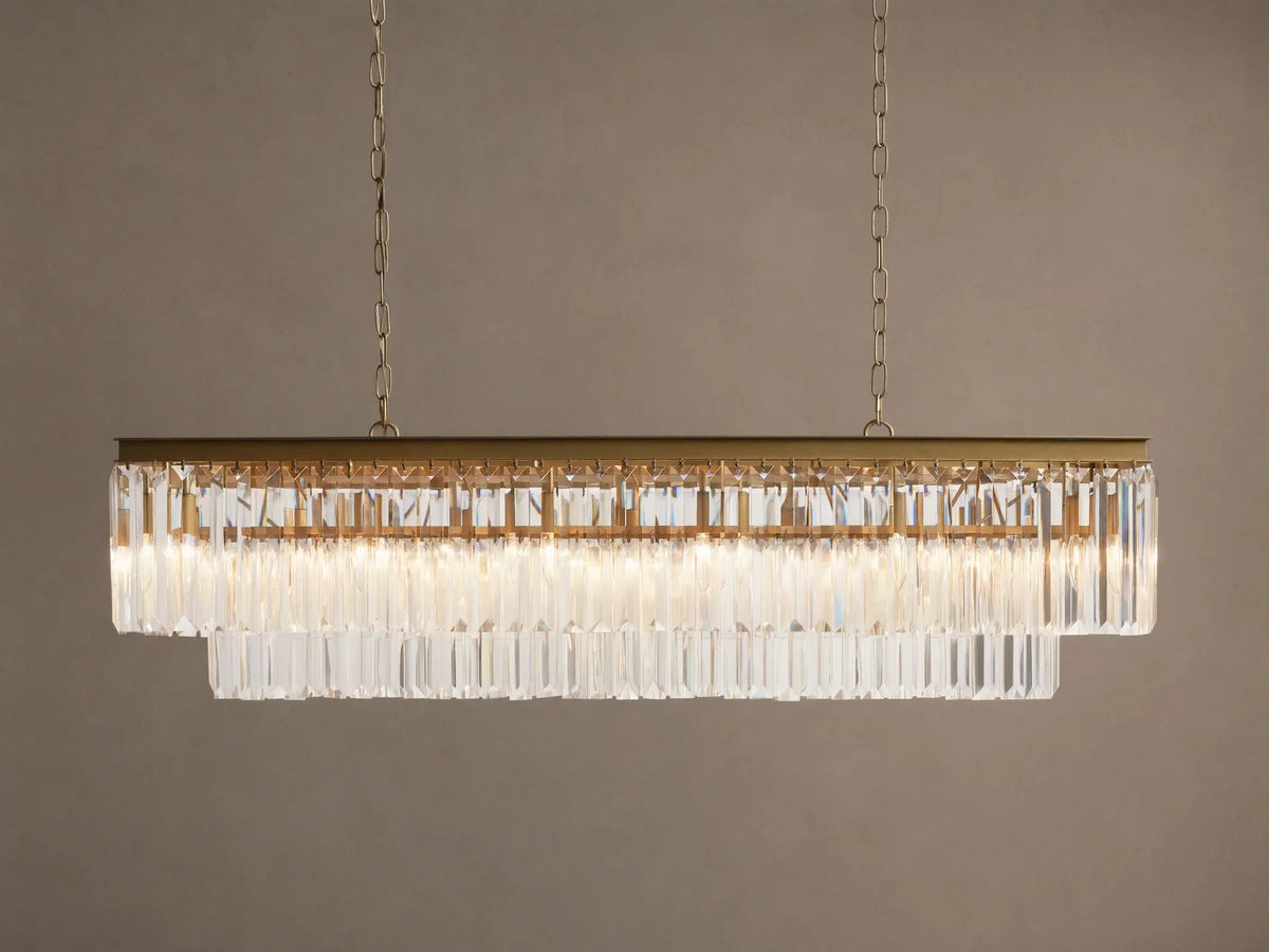 Leyland Tiered Rectangular Chandelier: Oil-rubbed bronze frame with two tiers of clear K9 glass crystals, illuminated, hanging by chains.