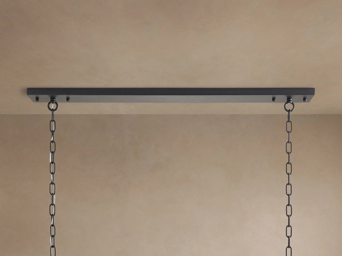 Close-up of Leyland Tiered Chandelier. Clear, rectangular K9 glass crystals hang from a dark, oil-rubbed iron frame.