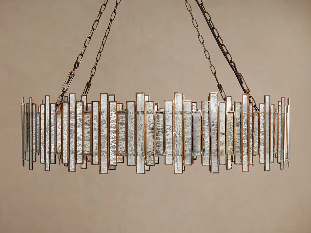 Laila Round Chandelier: Antique Copper with staggered, illuminated mirrored-glass panes, hanging from chains.