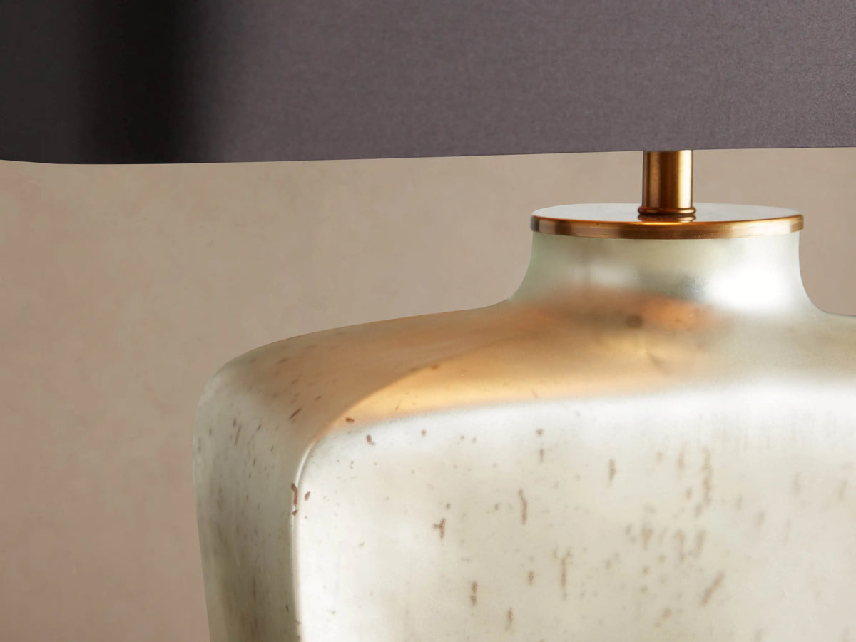 Balor Table Lamp: rectangular black shade, shimmering Antique Silver Rain glass base, gold finial, on wood.