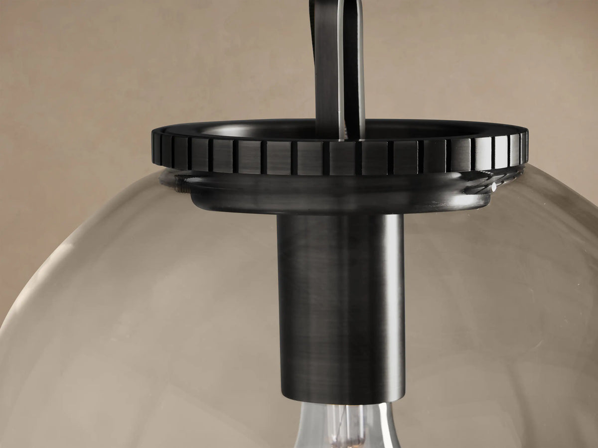 Wescott Globe Pendant with Chain, featuring a clear glass globe, an exposed filament bulb, and dark bronze metal hardware.