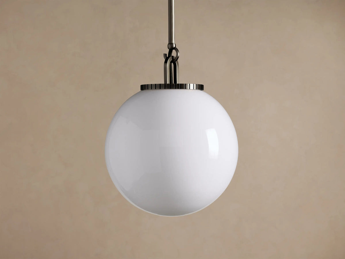 Wescott Globe Pendant with Rod features a glowing white milk glass globe suspended from a dark bronze metal rod.