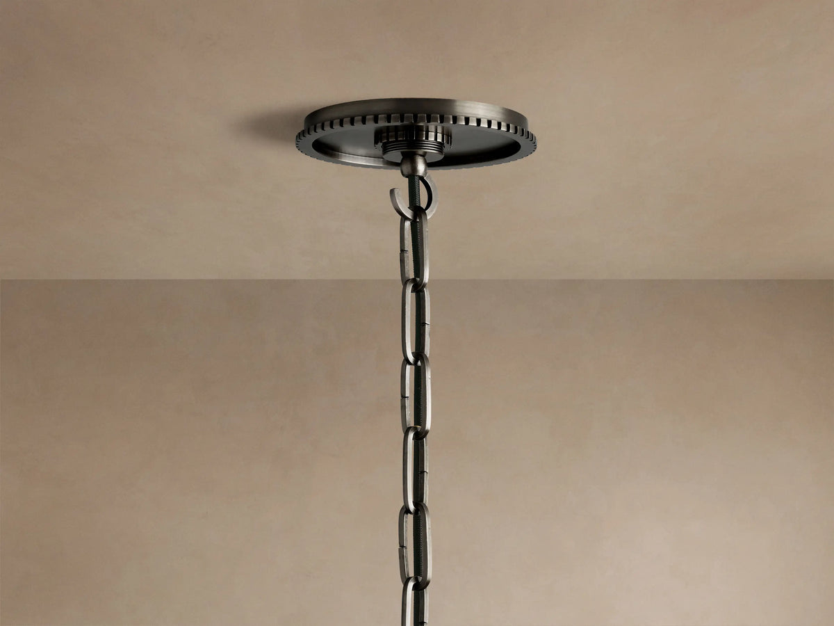 Wescott Globe Pendant: Close-up of white glass globe, dark brushed metal ring with ridges, and chain connection.