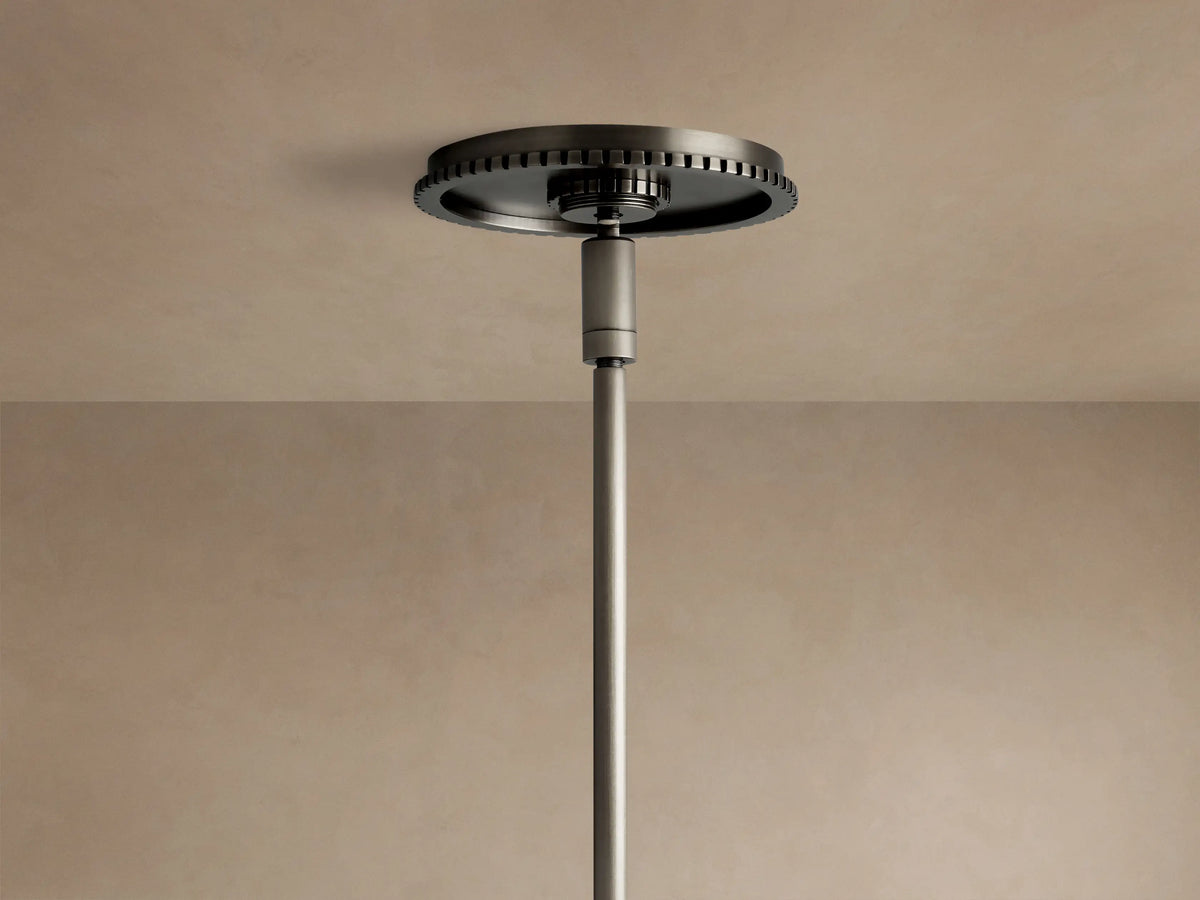 Wescott Globe Pendant: dark bronze rod connects to a ribbed ring over a white milk glass globe, against a light wall.
