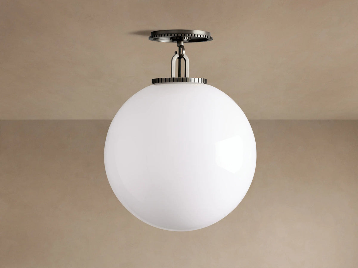 Wescott Globe Flush Mount with a large, white milk glass globe and dark bronze steel hardware, mounted on a light beige ceiling.