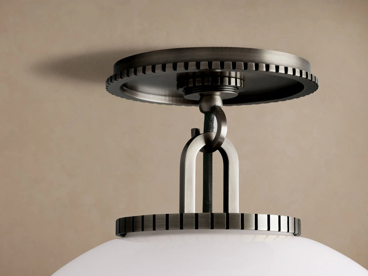 Wescott Globe Flush Mount with a large, white milk glass globe and dark bronze hardware, mounted on a ceiling.