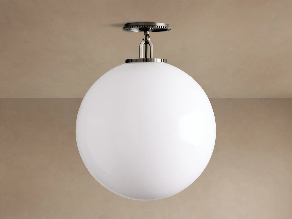 Wescott Globe Flush Mount with a large, matte white globe and dark bronze hardware, mounted on a light tan ceiling.