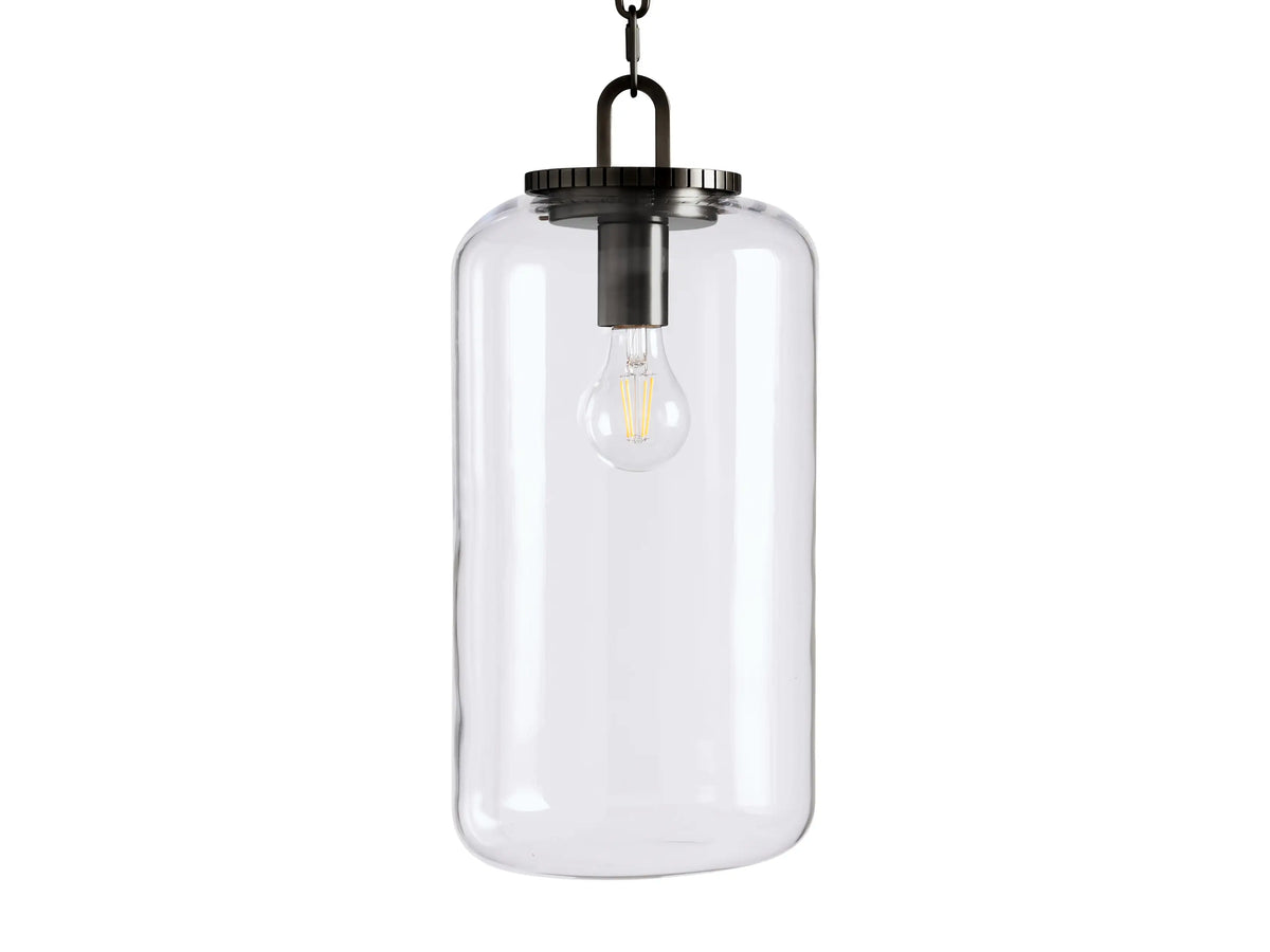 Wescott Cylinder Pendant with a clear glass shade, displaying visible bulb, suspended by black chain and metal fixture.