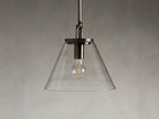 Close-up of the Wescott Cone Pendant in steel with a bronze finish, featuring a clear glass cone and a grooved metal top.