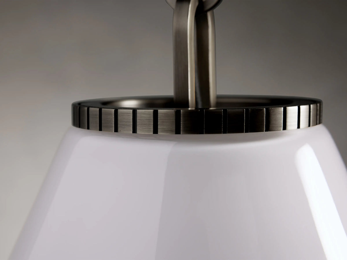 Wescott Cone Pendant with a polished steel top in a bronze finish and a smooth white glass cone shade, close-up view.