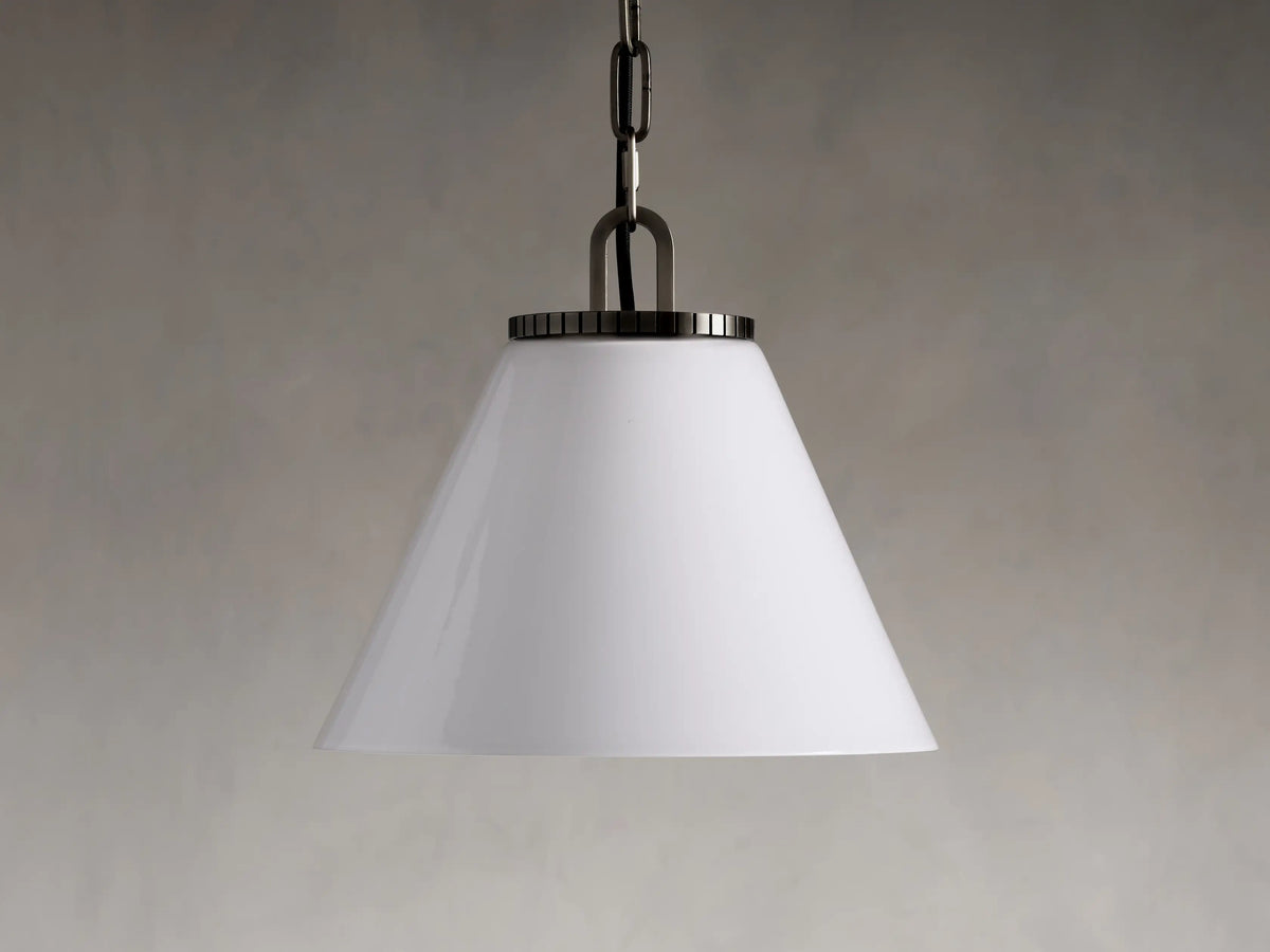 Wescott Cone Pendant with a smooth white glass canopy, dark metal chain, and brass or bronze accents against a neutral background.