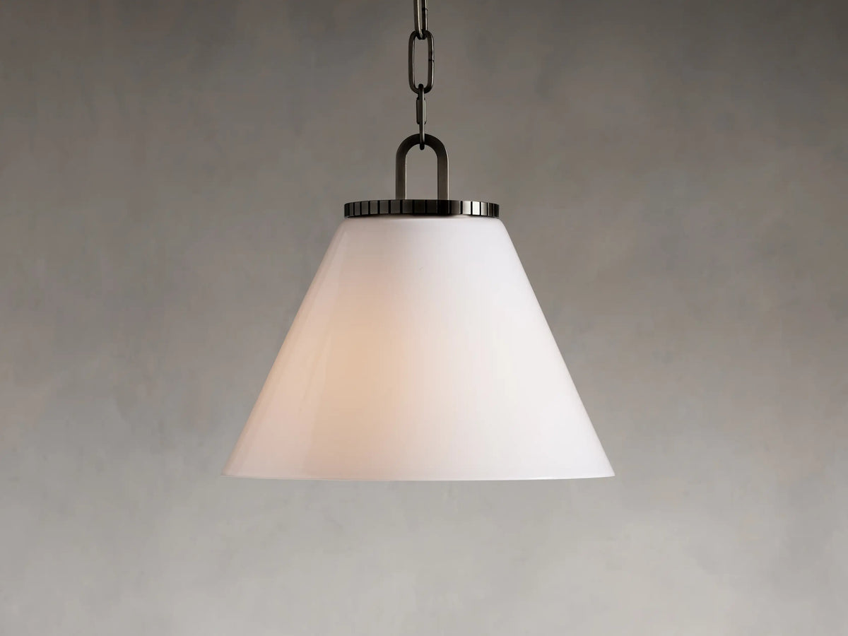 Wescott Cone Pendant with a white milk glass shade, suspended by a brass chain. Cone shape with sleek metal accent at top.