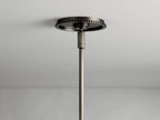Wescott Cone Pendant featuring a clear glass cone shade with a bronze finish steel rim and rod, shown in close-up view.