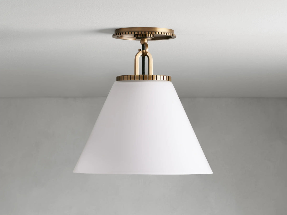 Wescott Cone Flush Mount featuring a brass finish with a white milk glass cone shade, mounted on a circular base with a textured design.