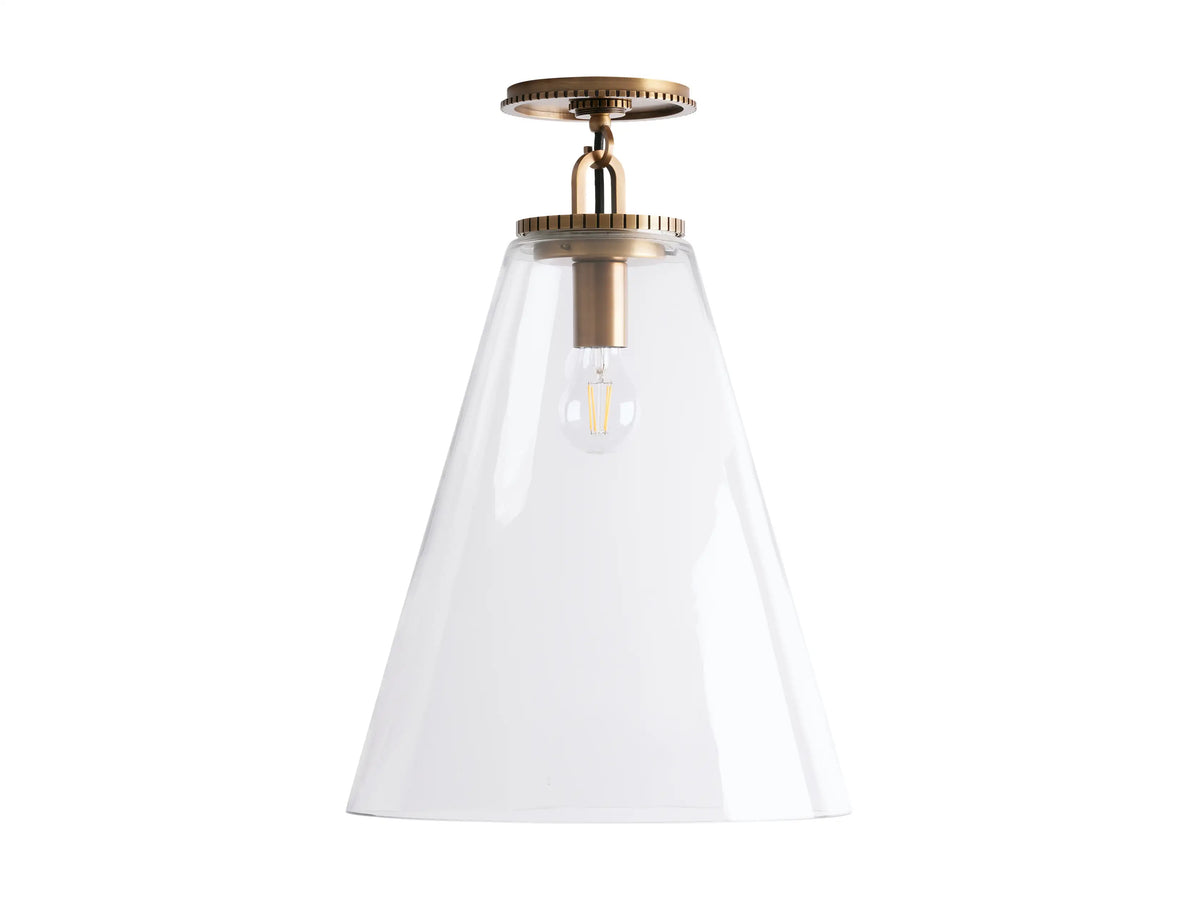 Cone-shaped flush mount light with clear glass shade, brass finish socket, and visible bulb inside, attached to ceiling.