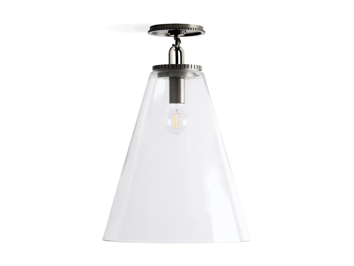 Wescott Cone Flush Mount with clear glass cone shade, metal fixture in bronze finish, visible bulb inside. Ceiling-mounted light.