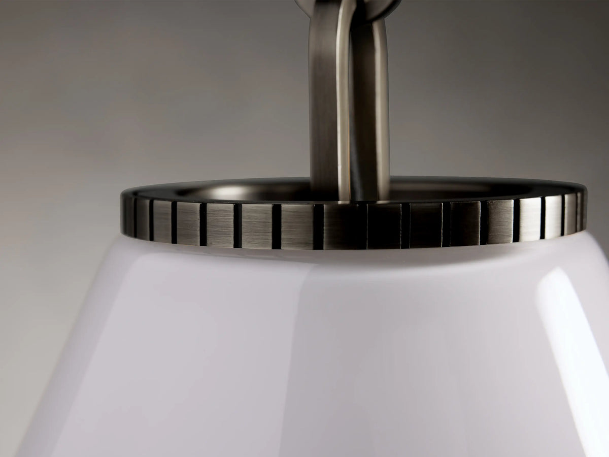 Close-up of the Wescott Cone Pendant showing the top section of a white glass cone shade with a brass-finish steel rim.