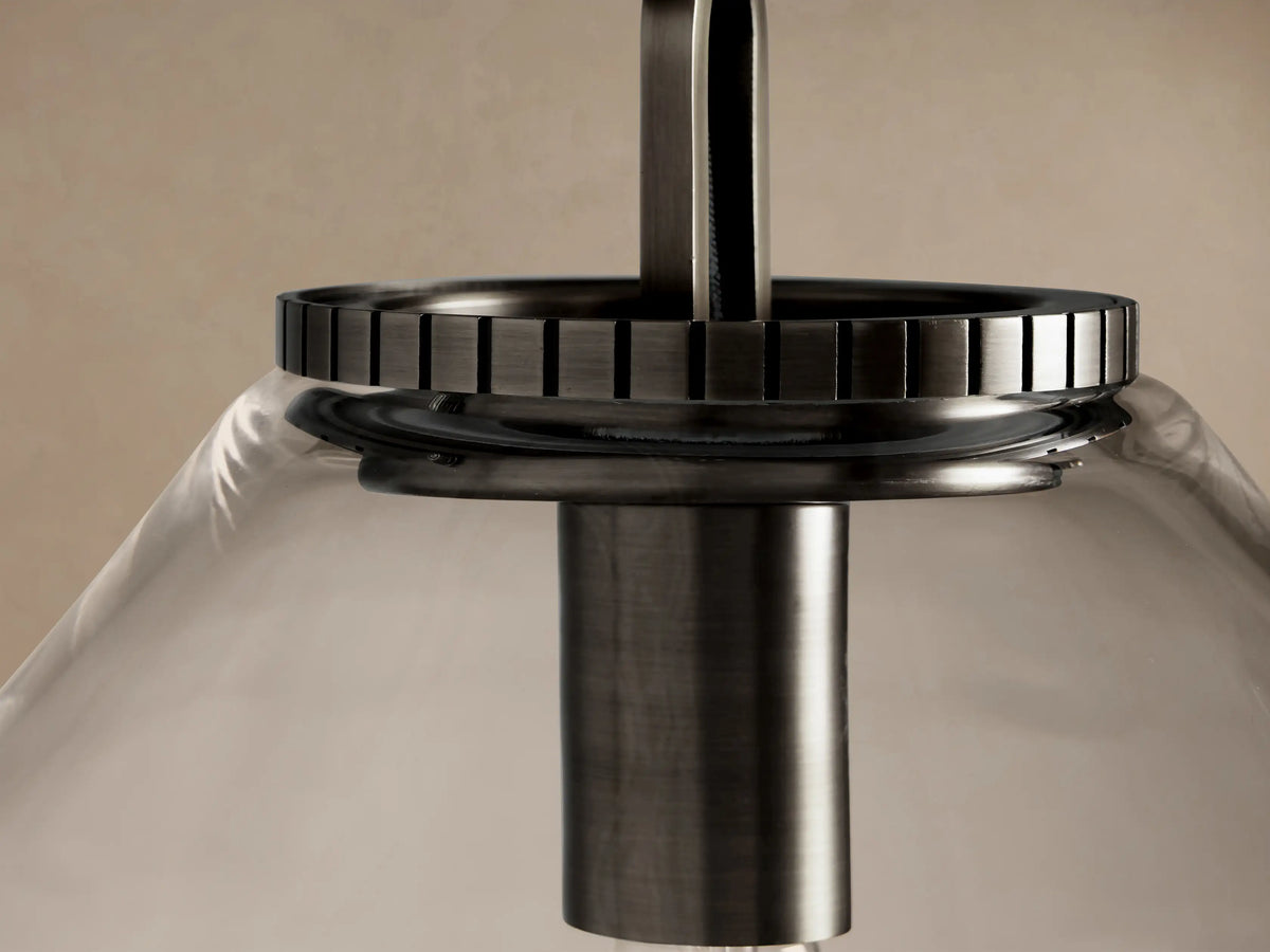 Wescott Cone Pendant with clear conical glass shade, dark bronze metal chain, and exposed Edison bulb against a light wall.