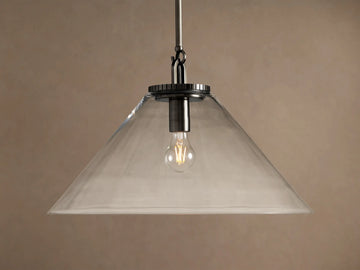 Wescott Cone Pendant light with a clear glass cone shade, dark metal rod, and visible illuminated Edison bulb.