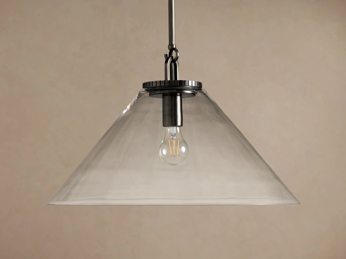 Wescott Cone Pendant light with a clear glass cone shade, dark metal rod, and visible illuminated Edison bulb.