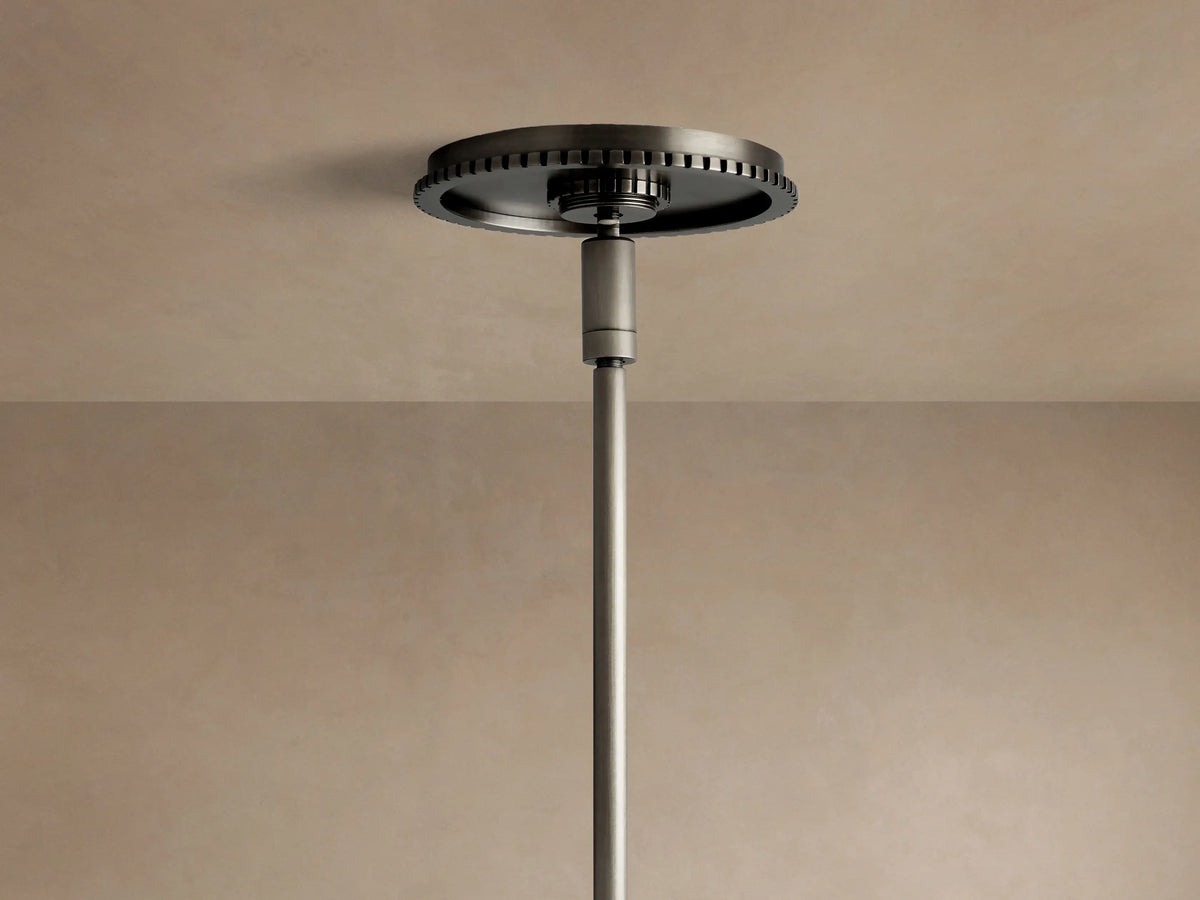 Close-up of Wescott Cone Pendant with dark metal rod, hook, and ribbed circular fixture holding a clear glass shade.