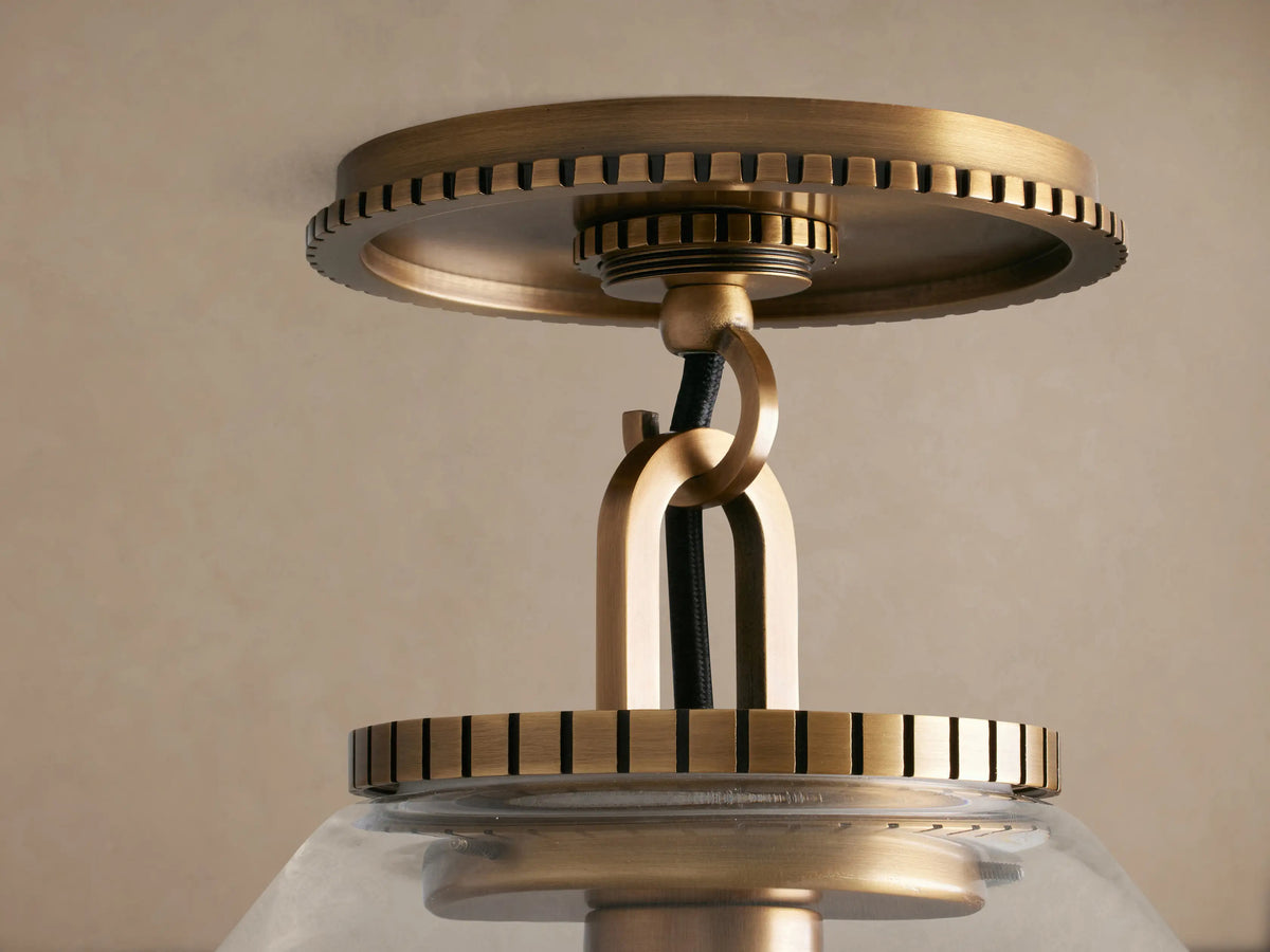 Wescott Cone Flush Mount, brass hardware with ribbed details, clear glass cone shade, central unlit bulb, mounted on ceiling.