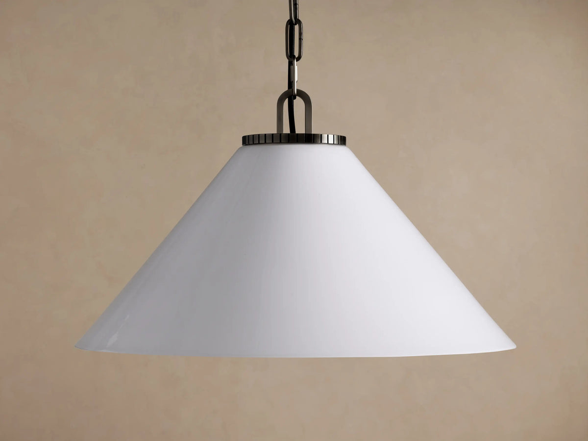 Wescott Cone Pendant: White milk glass cone shade suspended by a dark metal chain on a neutral brown background.
