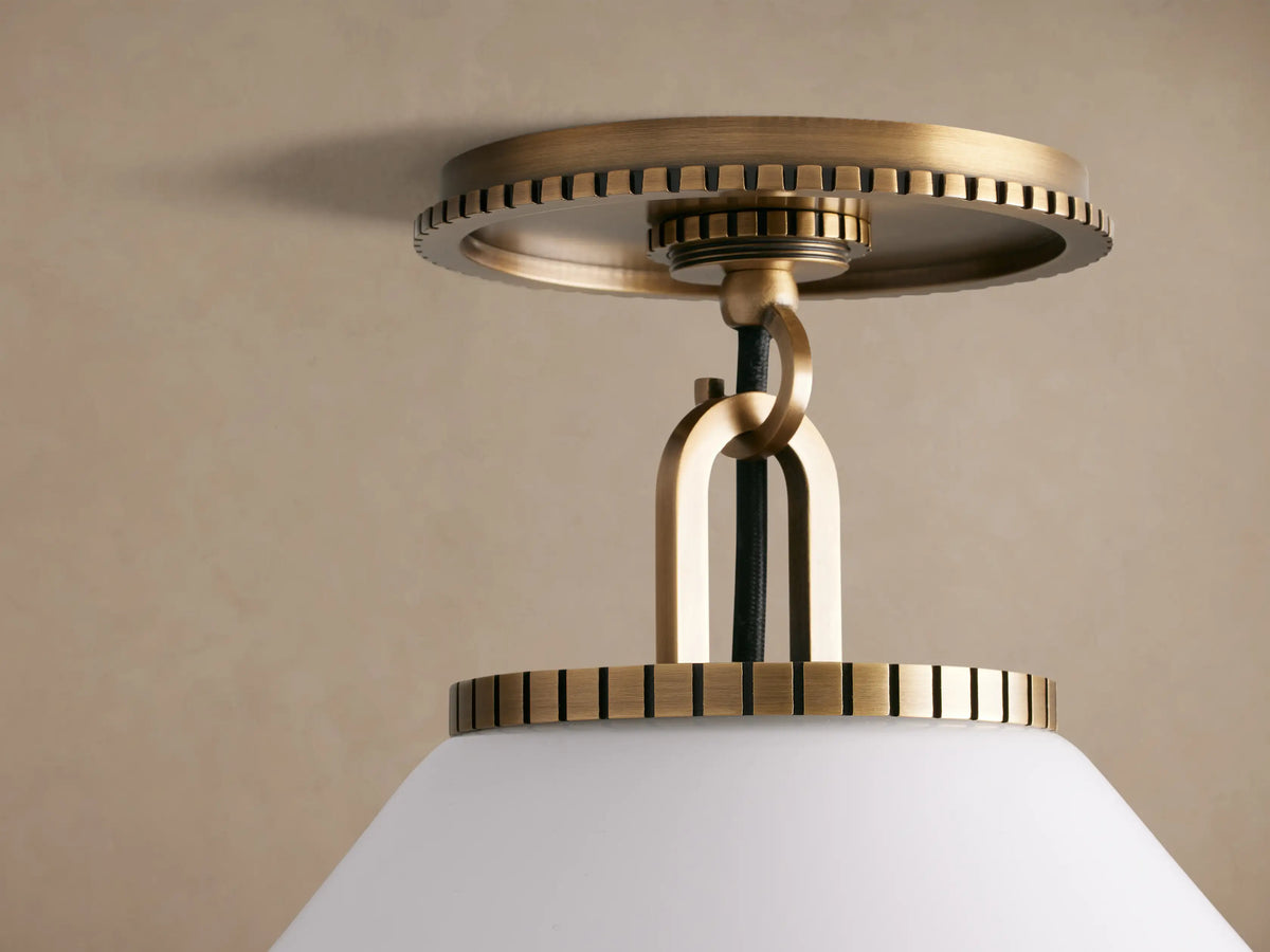 Wescott Cone Flush Mount, brass finish with ribbed detailing, and a white milk glass cone shade against a beige ceiling.