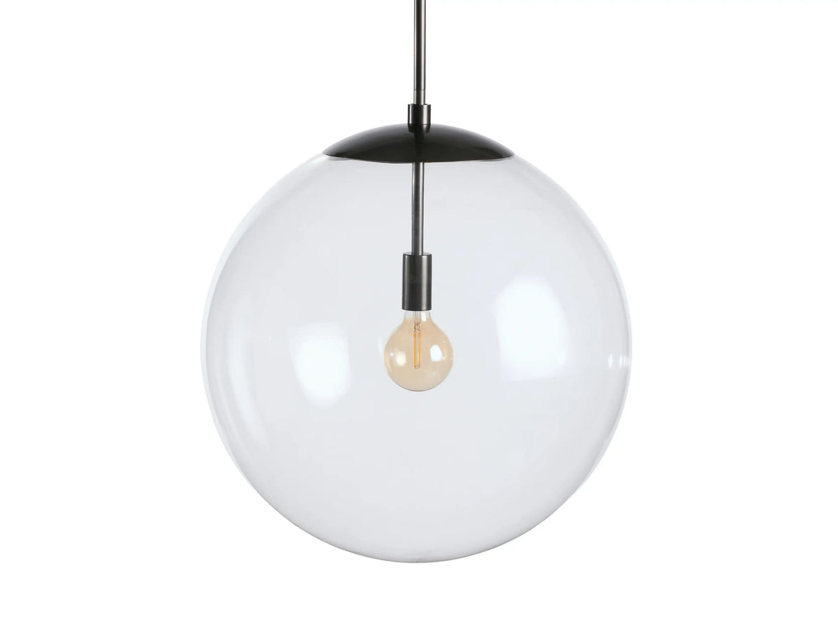 Clear glass globe pendant with visible filament bulb, sleek bronze rod, and black fabric-wrapped cord against a neutral wall.