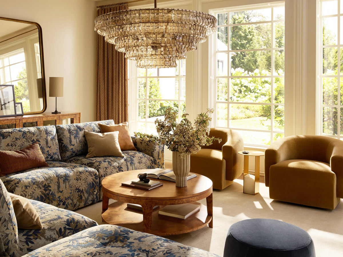Ghiaccio Round Chandelier: tiered, smoky curved glass panels, illuminated from within, suspended by a brass chain.