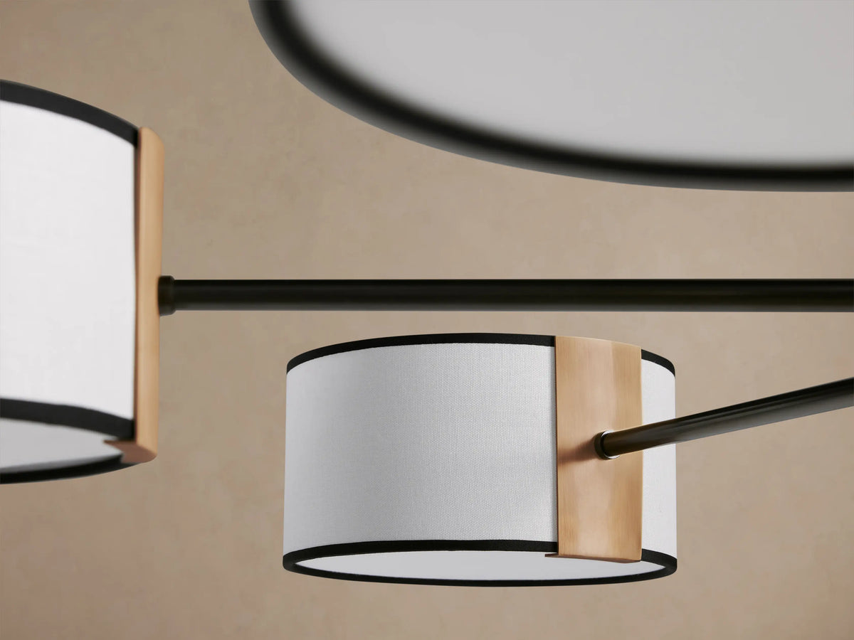 Daphne Fabric Round Chandelier with dark bronze frame, six white linen shades with black trim, and light bronze accents.