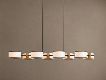 Daphne Fabric Linear Chandelier with 6 white fabric shades, black trim, and gold accents, hanging from two dark rods.
