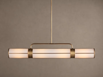 Remming Linear Chandelier: horizontal fixture with three glowing milk glass shades and burnished brass framework.