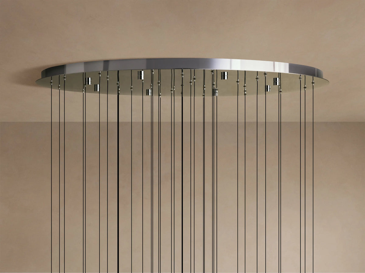 Close-up of the Solitaire Round Chandelier's teardrop-shaped glass pendants, each with a textured interior and metal accents.