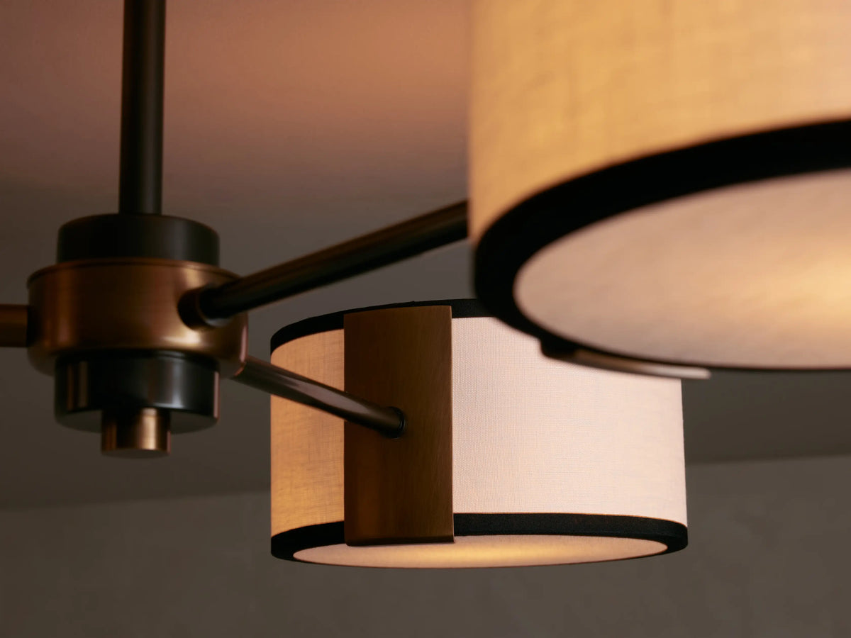 Daphne Fabric Flush Mount with three white linen shades, black trim, and bronze and dark metal hardware on a ceiling.