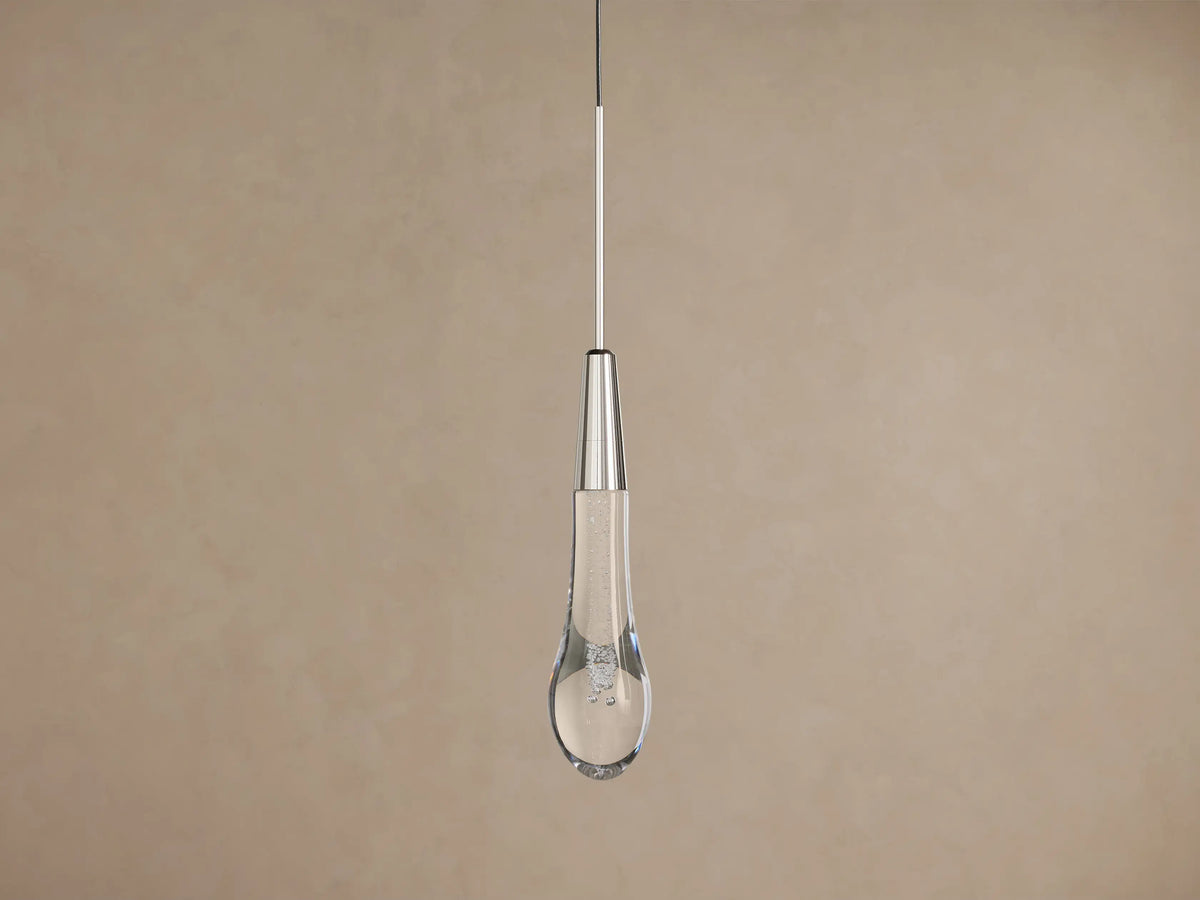 Soltaire Pendant, a nickel-finished cylinder above a clear glass teardrop with sparkling bubbles and a warm LED glow.