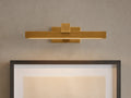 Corinth Picture Light Sconce, brass rectangular bar with LED light, mounted on wall above framed art.