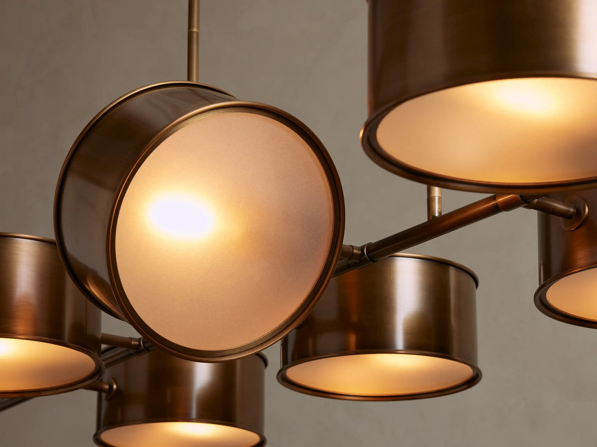 Daphne Metal Linear Chandelier close-up: antique brass oval canopy attached to ceiling, two support rods hanging down.