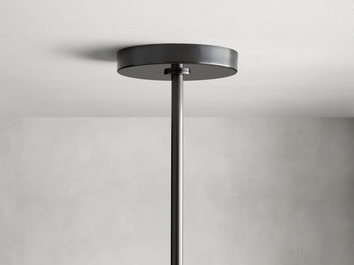 Noella Bronze Chandelier with visible Edison-style bulb in a clear glass orb shade, connected to a black metal rod.