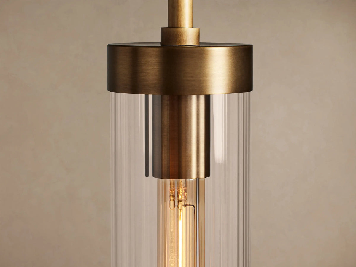 Andreas Pendant: brass-plated rod & fixture, clear fluted glass cylindrical shade, visible tubular filament bulb.