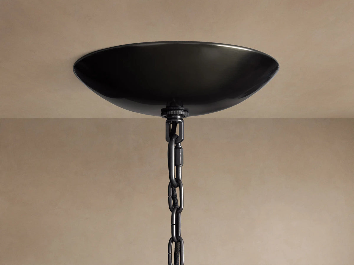 Ghiaccio Round Chandelier close-up: black, bowl-shaped ceiling canopy with a black chain hanging from a light ceiling.