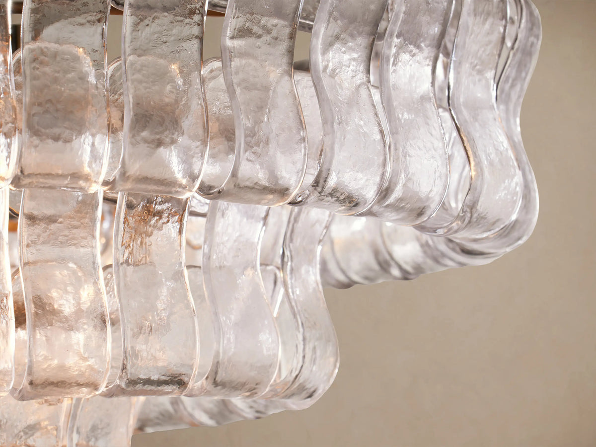 Ghiaccio Oval Chandelier: multi-layered, clear textured glass panels form an oval shape, suspended by two gold chains.