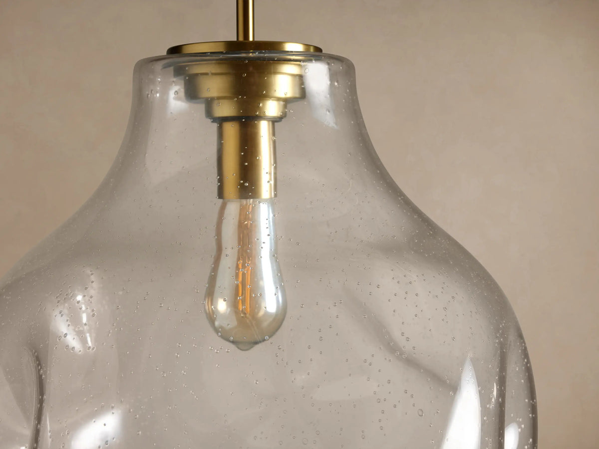 Organic 16" Pendant: Clear, organic-shaped, speckled glass shade with vintage bulb, brass accents, hanging.