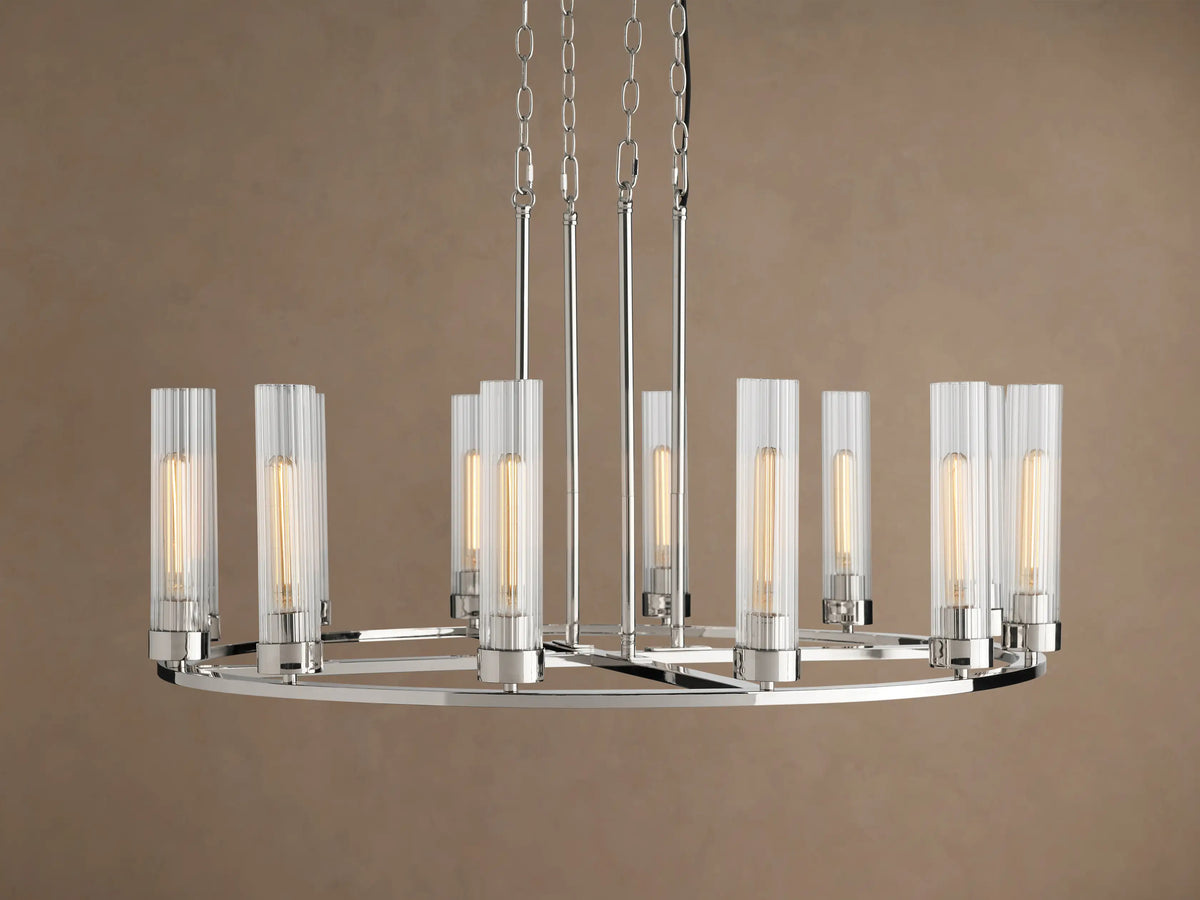 Andreas Round Chandelier, polished nickel finish, round frame, 12 glowing bulbs in clear fluted glass shades, suspended by chains.