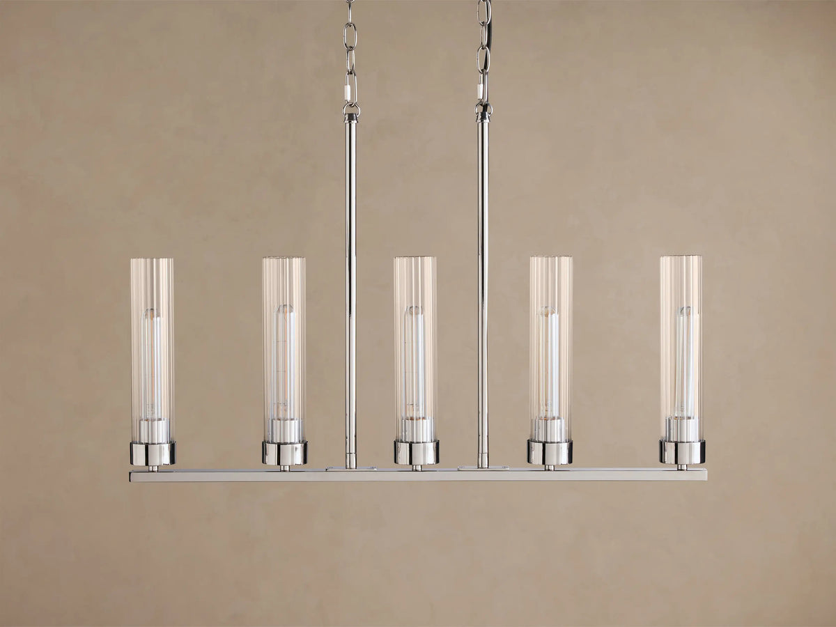 Andreas Linear Chandelier, 5-light, with ribbed clear glass shades, filament bulbs, & polished chrome finish, hanging straight-on.