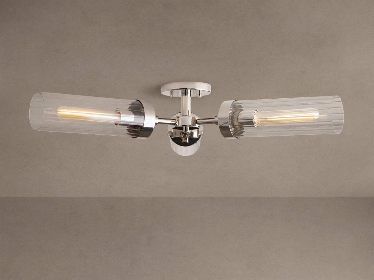 Andreas Flush Mount, polished nickel, with two horizontal clear ribbed glass shades, showcasing glowing filament bulbs.