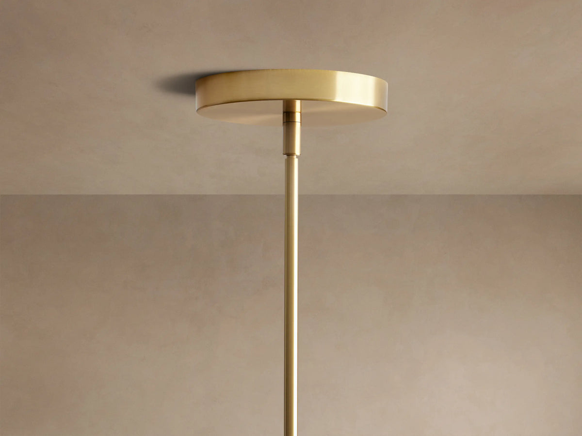 Organic 16" Pendant: Close-up of smoky gray, mouth-blown bubbled glass shade, brass fixture & warm glowing bulb.