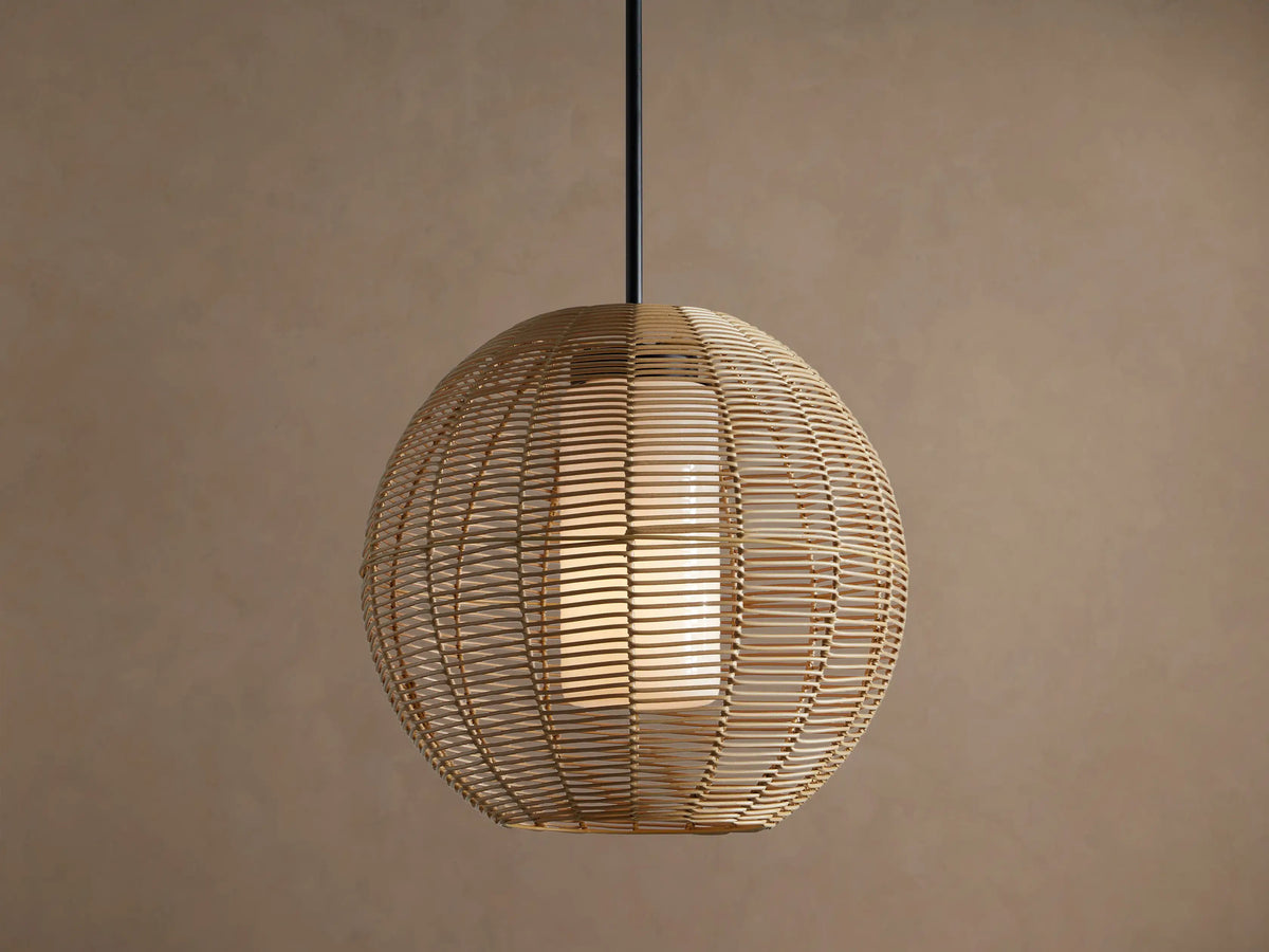 Cohen Globe Outdoor Pendant: natural woven wicker globe with internal glowing white glass shade, hanging from a matte black rod.