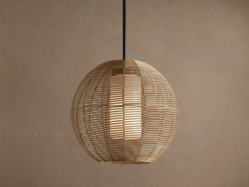 Cohen Globe Outdoor Pendant: natural woven wicker globe with internal glowing white glass shade, hanging from a matte black rod.
