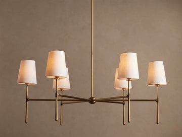 Rhodes Round Chandelier, 6-light, with burnished brass frame & 6 glowing tapered linen shades.